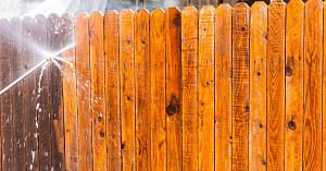 Fence being soft washed